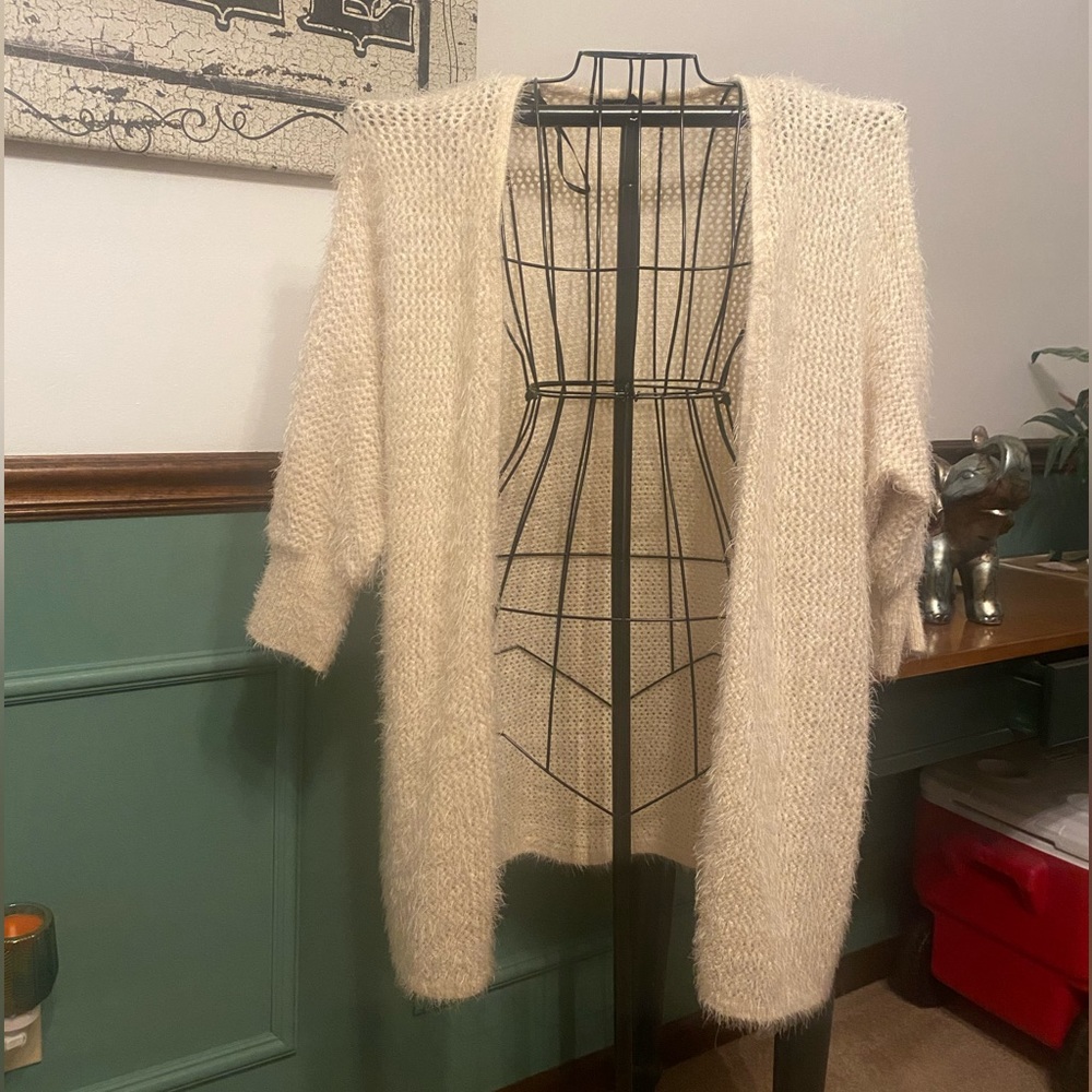 Soft, crème color cardigan. Beautiful and light. Size Large. Never worn.